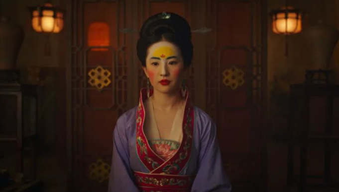 “当窗理云鬓，对镜贴花黄。”如何翻译？